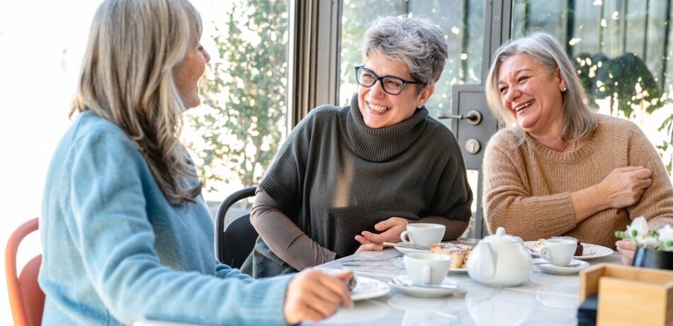 Three women have breakfast in a restaurant.